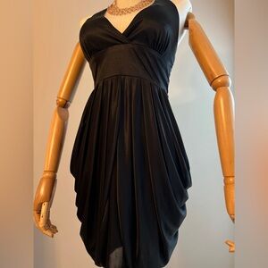 Black halter dress with sheer draping a hips. Smoke free pet free worn once.